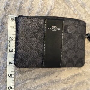 Coach monogrammed wristlet in black
